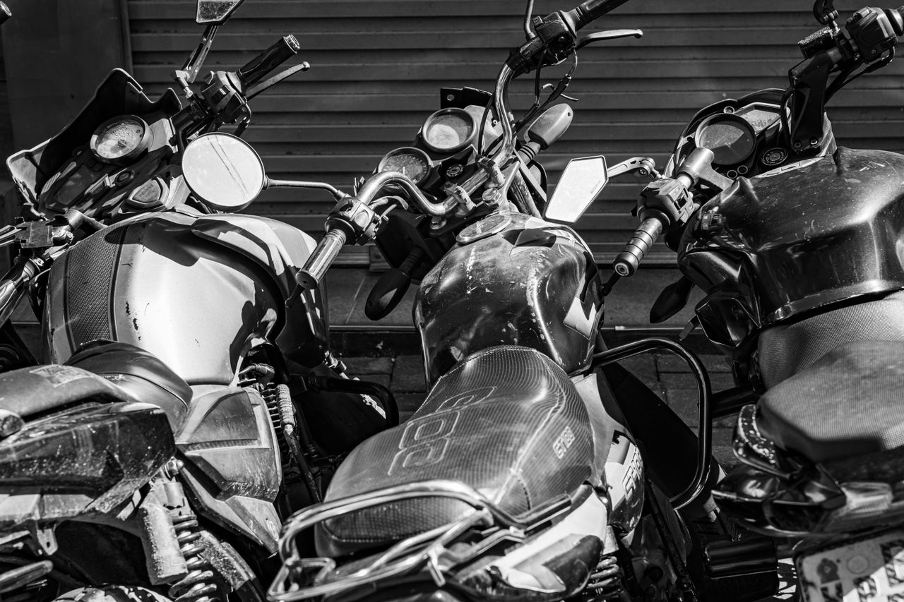 Close-up view of parked motorcycles in black and white, capturing urban life in Colombo, Sri Lanka.